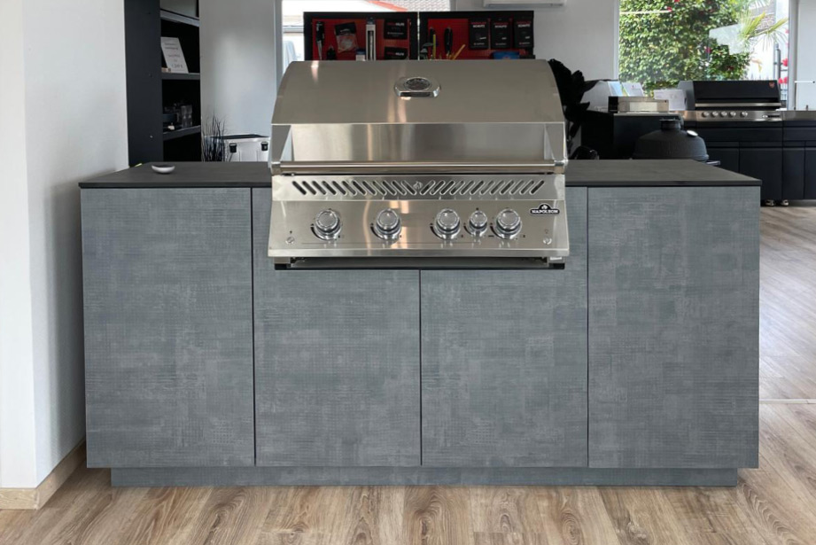 Outdoor kitchen made of HPL with Napoleon built-in barbecue