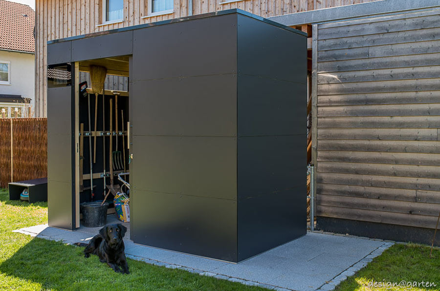 Small garden house in anthracite - modern design with an open door