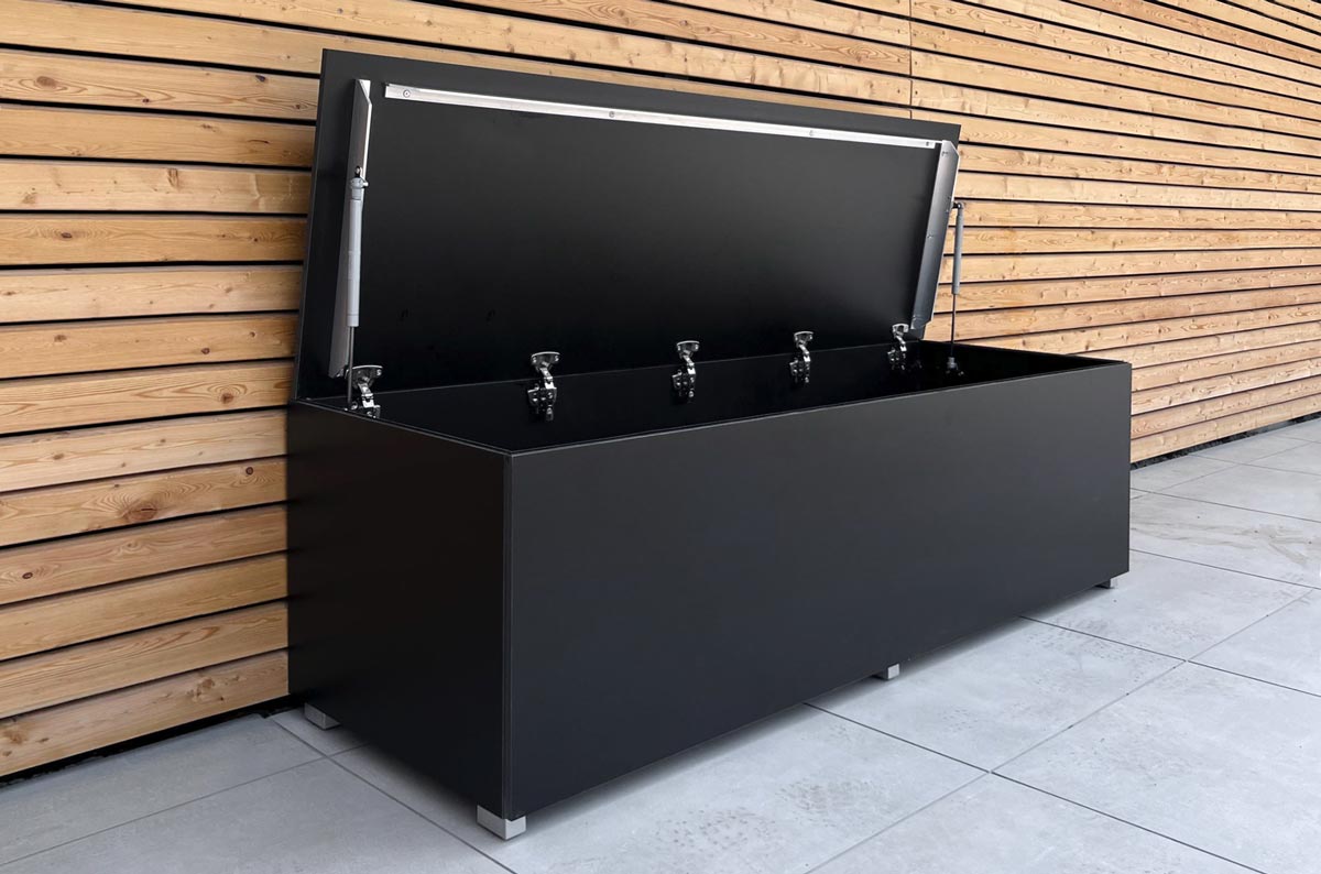 Black garden box with open hinged lid and gas struts