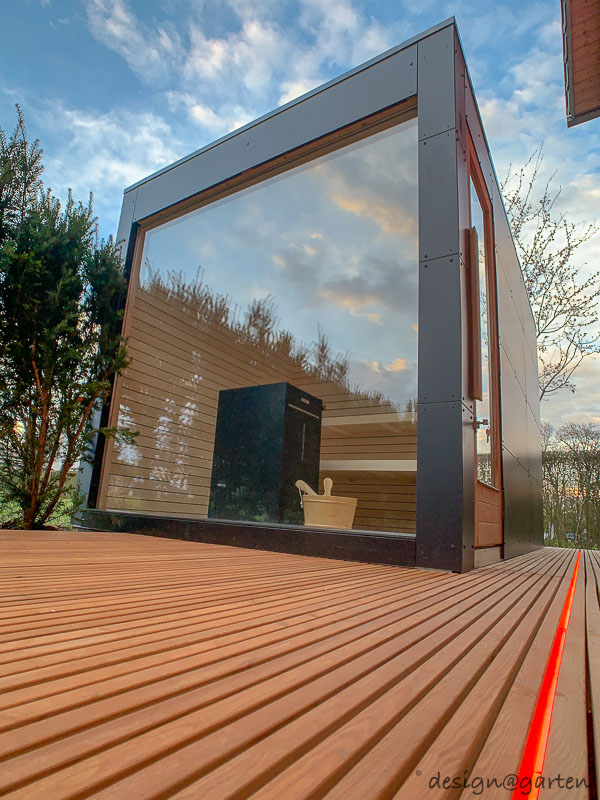 Designer wellness in the garden: sauna garden shed with panoramic glazing