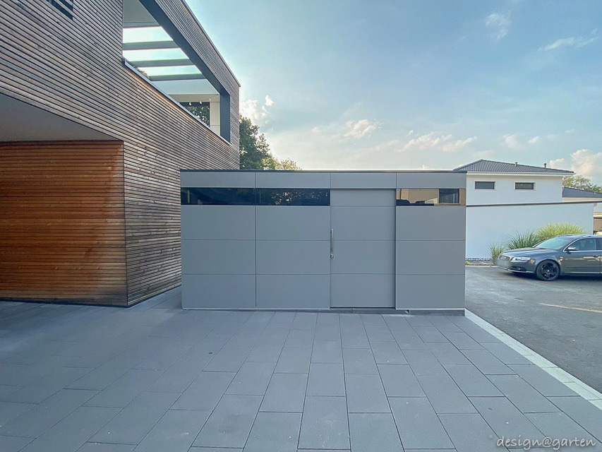 Architect-designed garden shed with flat roof as a modern storage solution in the Frankfurt area