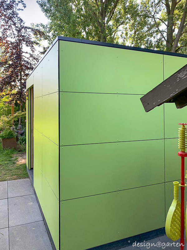 Extravagant garden shed surrounded by greenery 1