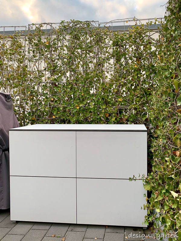 Customised weatherproof tall cabinet: elegant volume and functional terrace design 8