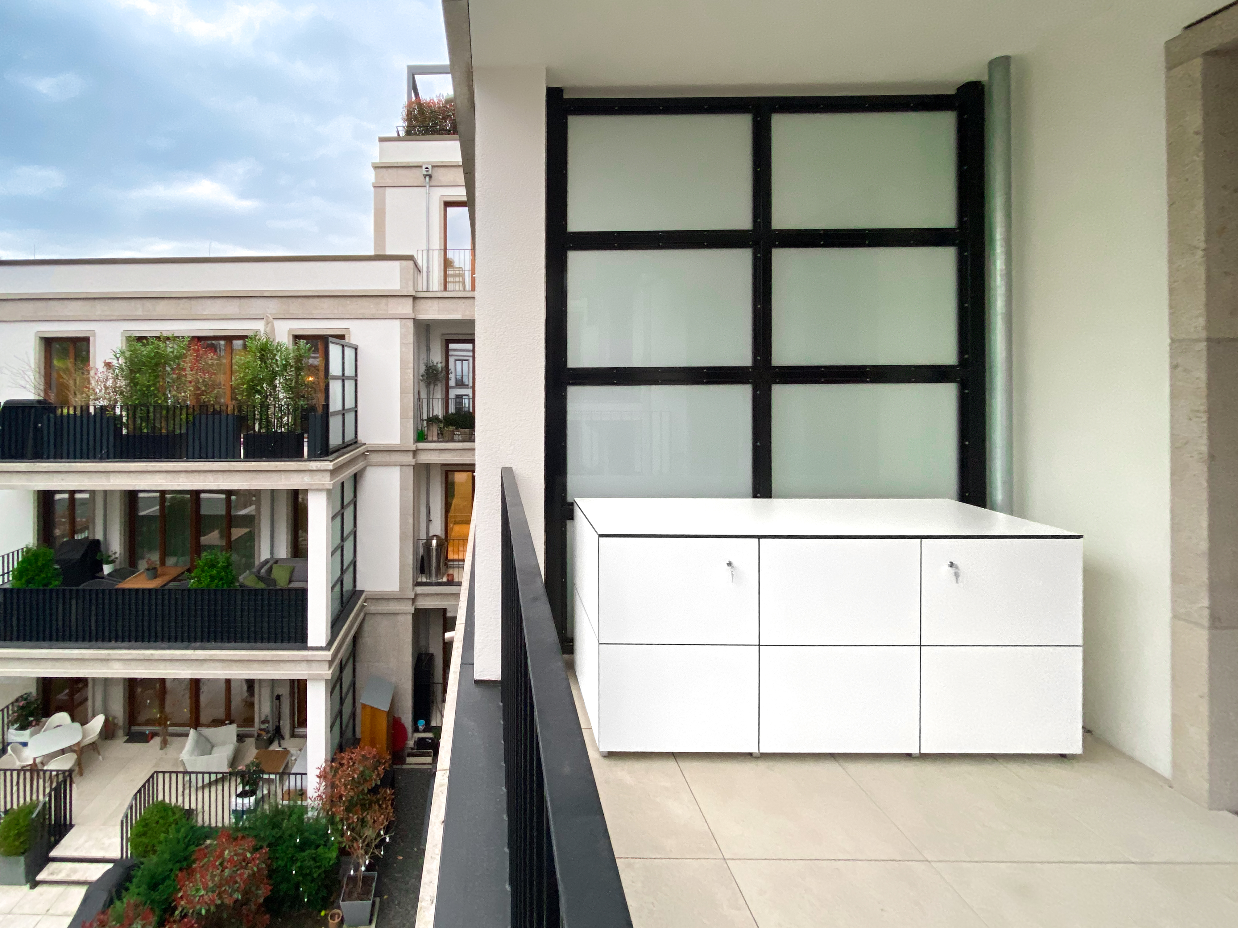 Stylish architect-designed outdoor cabinet made of HPL in a linear design 1