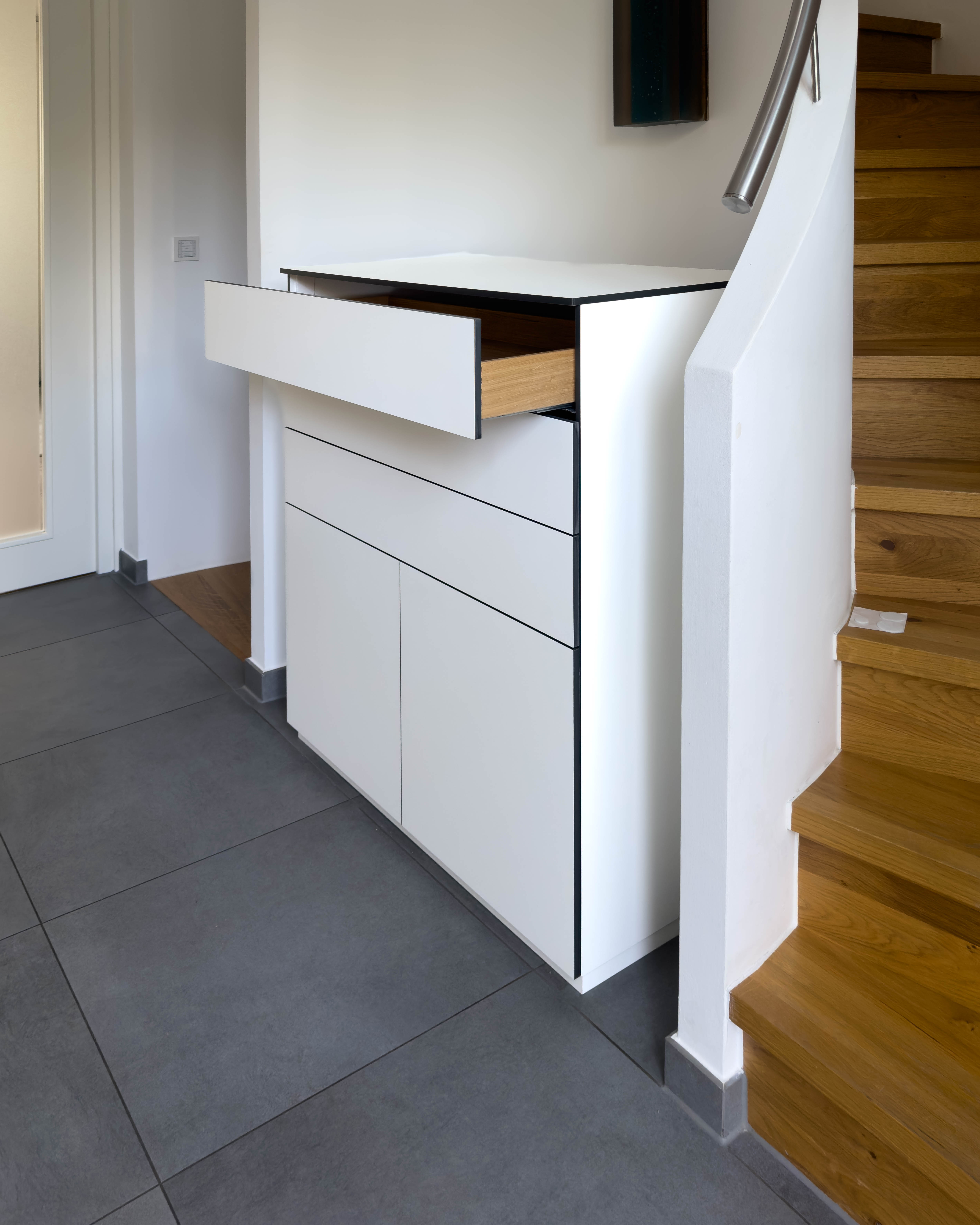 Custom-made cabinet made of HPL in white 3